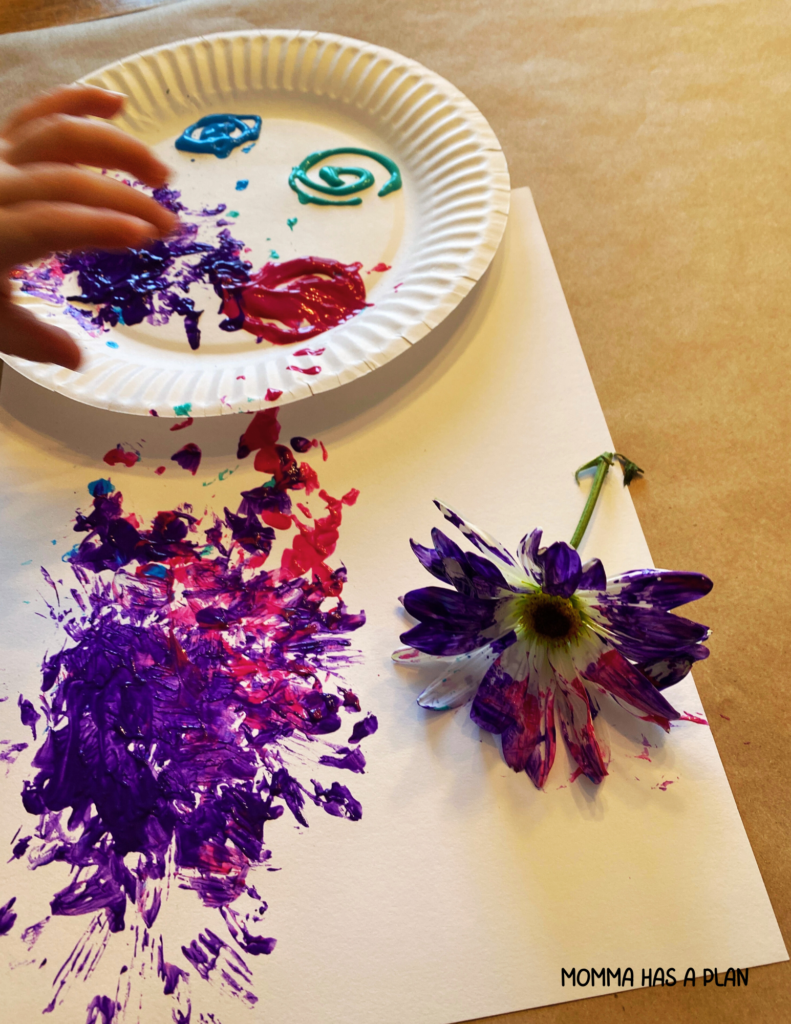 painting with flowers process art for toddlers