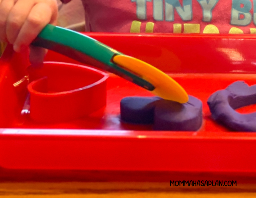 1-year-old playing with playdough