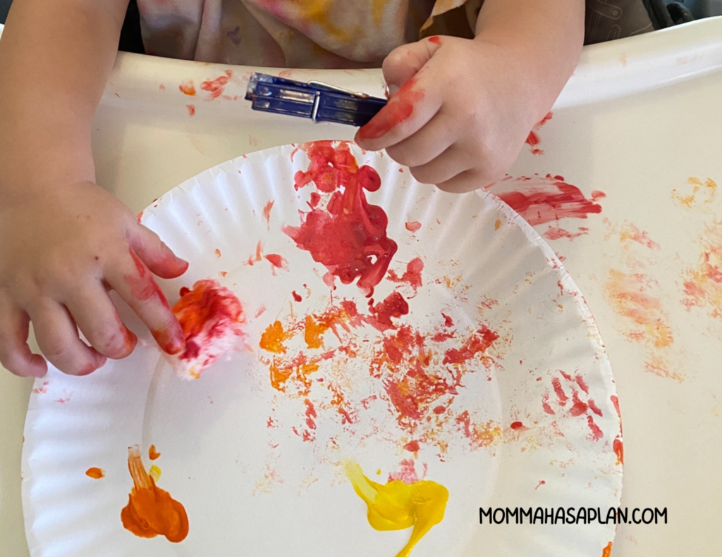 Messy art project with 1-year-old. Painting with cotton ball